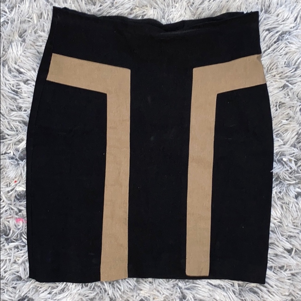 Black bodycon skirt with tan detail.